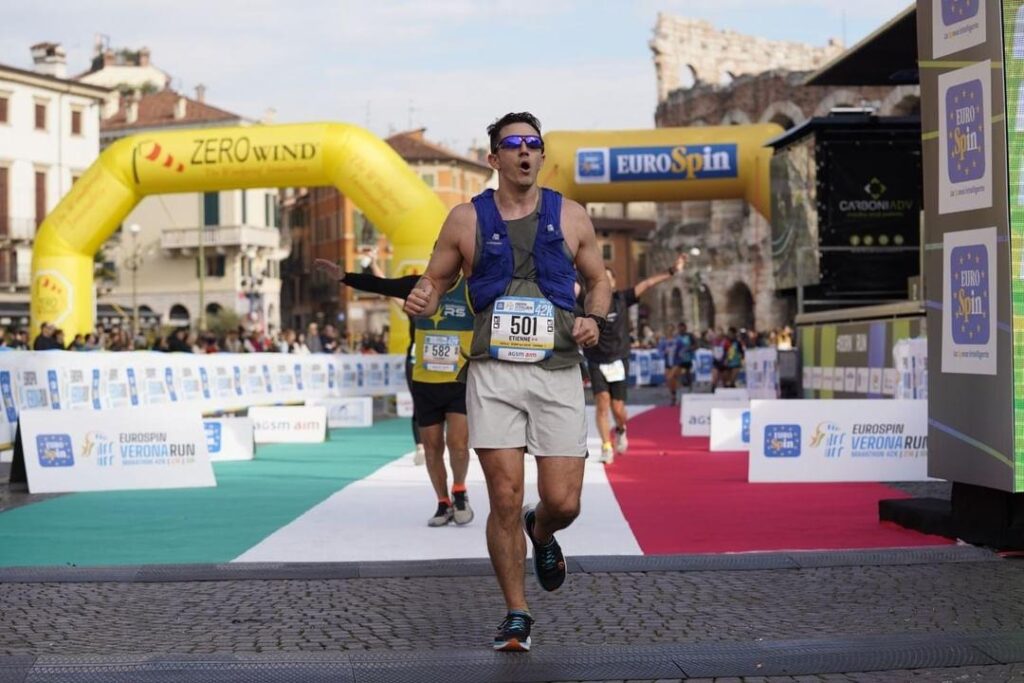 Etienne crossing the finish line of his marathon